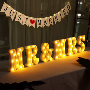 Illuminated Mr & Mrs Lighted Sign Letters on a wedding table.
